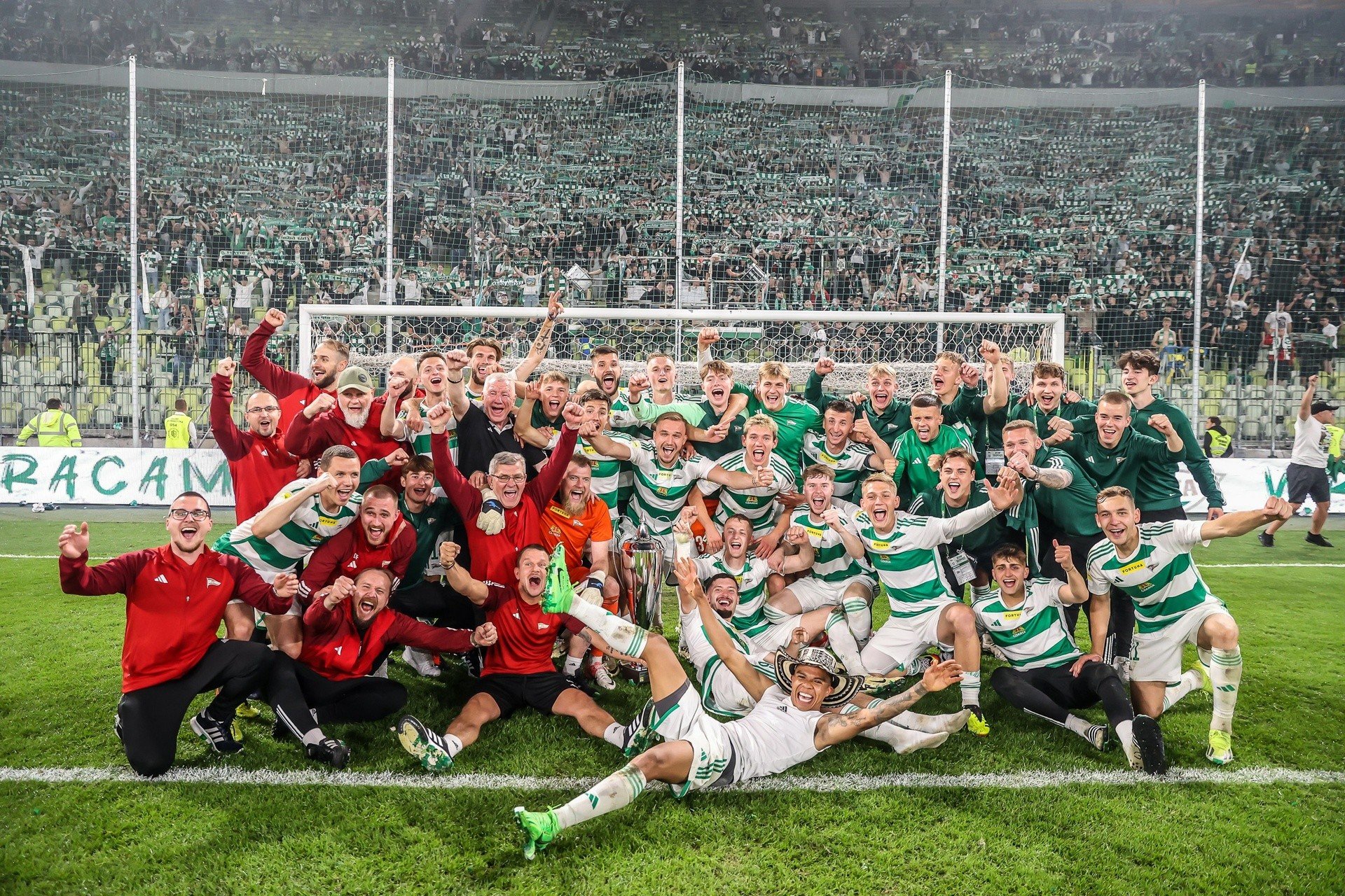 Lechia Gdańsk celebrates at Neptune at night. In Arka Gdynia they have to drink the beer they brewed